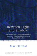 Cover of Between Light & Shadow: The World bank, the IMF and International Human Rights Law